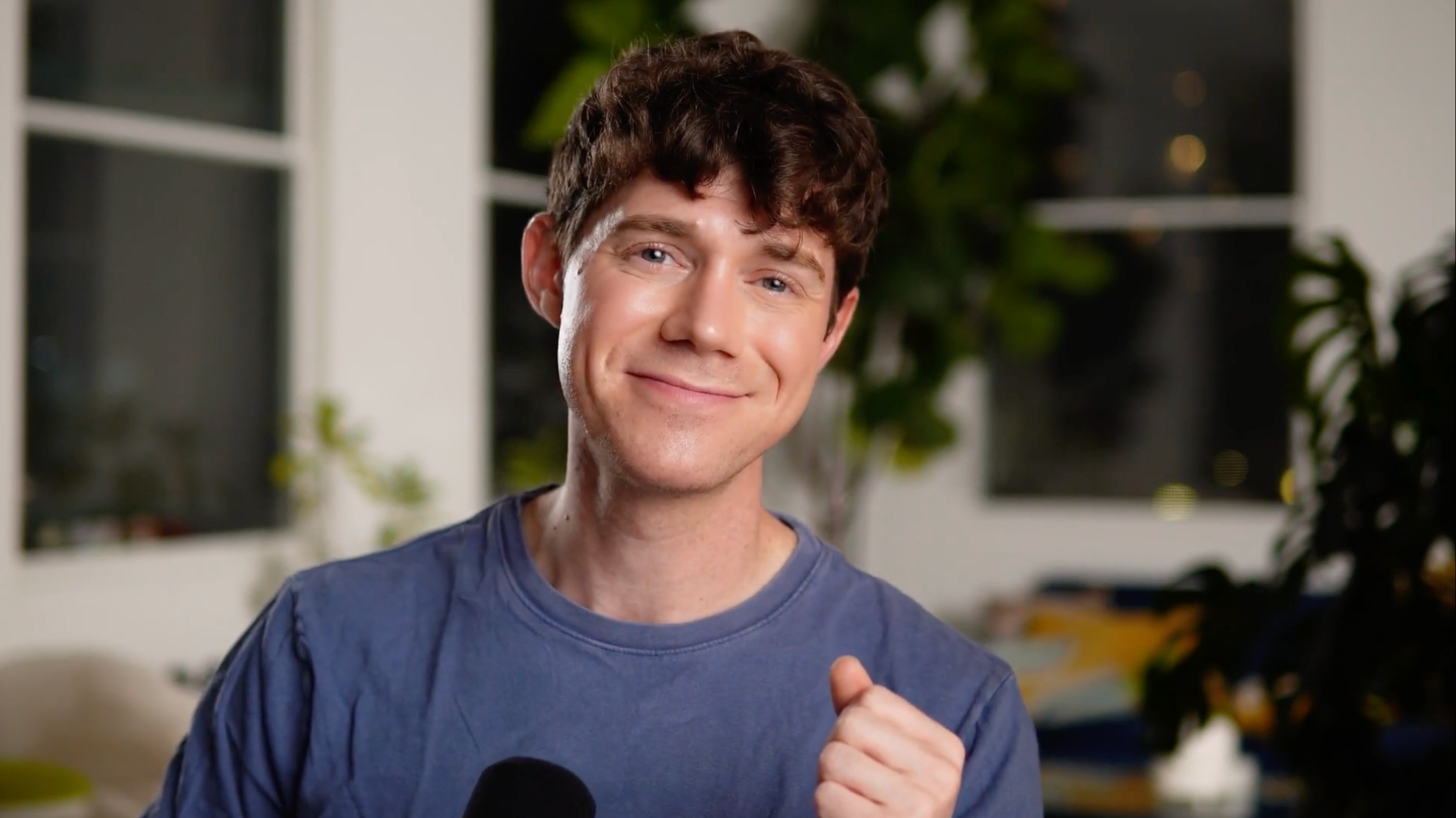 A smiling speaker in a blue shirt in a recorded ShowUp teaching frame.
